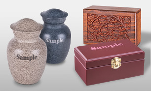 A collection of pet cremation aftercare products including wood and metal urns